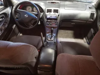 2002 Nissan Maxima GXE z VIN JN1DA31D82T429859, wystawiony jako Copart lot #67025674 z przebiegiem 153 180 mil mil oraz Szkoda całkowita • Salvage title. Historia ofert i sprzedaży dostępna na DreamBid. Obrazek 8.