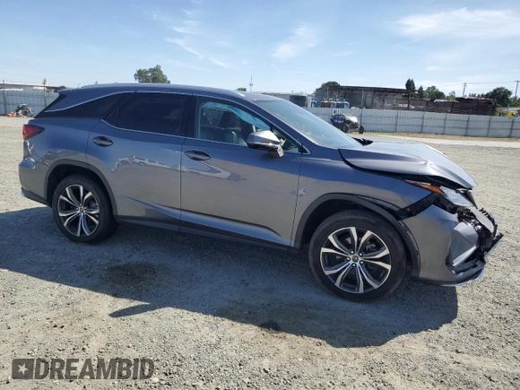 2020 Lexus RX 350L with VIN JTJHZKFA4L2027079, listed as a Copart auction lot 57151485 with 60,890 mi miles and Salvage title. Bid and sale history available at DreamBid. Image 4.
