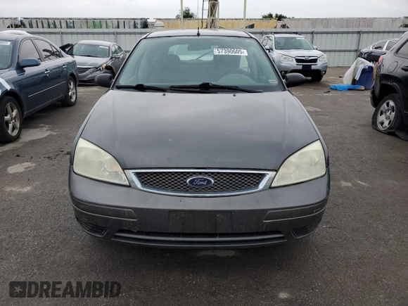 2005 Ford Focus S with VIN 3FAFP37N75R120187, listed as a Copart auction lot 57390605 with 163,547 mi miles and Salvage title. Bid and sale history available at DreamBid. Image 5.