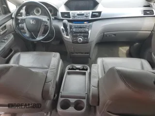 2012 Honda Odyssey Touring with VIN 5FNRL5H94CB102177, listed as a Copart auction lot 55942185 with 179,418 mi miles and Salvage Title. Bid and sale history available at DreamBid. Image 8.