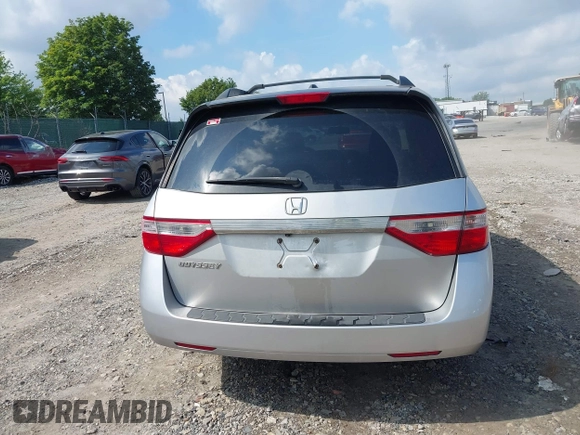 2012 Honda Odyssey EX-L with VIN 5FNRL5H61CB081634, listed as a IAAI auction lot 42760909 with 197,949 mi miles and . Bid and sale history available at DreamBid. Image 17.