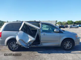 2015 Dodge Grand Caravan SXT with VIN 2C4RDGCG3FR592098, listed as a IAAI auction lot 42038665 with 104,092 mi miles and . Bid and sale history available at DreamBid. Image 6.