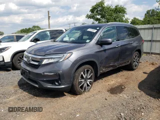 2021 Honda Pilot Elite with VIN 5FNYF6H06MB067878, listed as a Copart auction lot 61585085 with 99,551 mi miles and Salvage title. Bid and sale history available at DreamBid. Image 1.