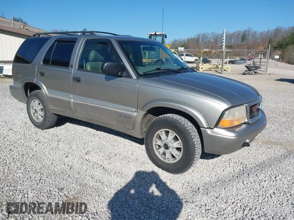 2001 GMC Jimmy SLE z VIN 1GKDT13W812117348, wystawiony jako IAAI lot #41846712 z przebiegiem 180 977 mil mil oraz . Historia ofert i sprzedaży dostępna na DreamBid. Obrazek 1.