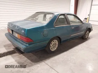 1993 Ford Tempo z VIN 1FAPP31X5PK229656, wystawiony jako IAAI lot #41788568 z przebiegiem 64 620 mil mil oraz . Historia ofert i sprzedaży dostępna na DreamBid. Obrazek 4.