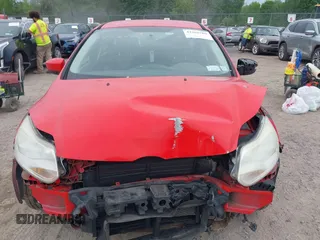 2012 Ford Focus SE z VIN 1FAHP3K23CL152488, wystawiony jako IAAI lot #42365769 z przebiegiem 185 763 mil mil oraz . Historia ofert i sprzedaży dostępna na DreamBid. Obrazek 13.