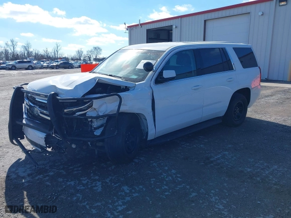 2020 Chevrolet Tahoe Commercial with VIN 1GNSKDEC2LR217697, listed as a IAAI auction lot 40815499 with 128,503 mi miles. Bid and sale history available at carsss.com. Image 2.