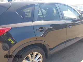 2014 Mazda CX-5 Grand Touring with VIN JM3KE4DY1E0339690, listed as a IAAI auction lot 41668780 with 216,825 mi miles. Bid and sale history available at carsss.com. Image 6.