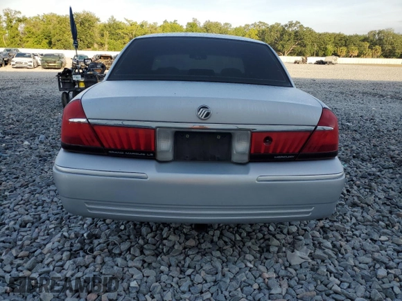 1999 Mercury Grand Marquis LS with VIN 2MEFM75WXXX682027, listed as a Copart auction lot 53906165 with 116,616 mi miles and Salvage Title. Bid and sale history available at DreamBid. Image 6.