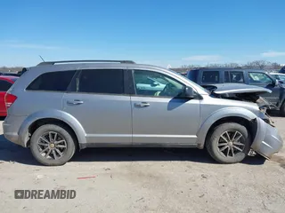 2017 Dodge Journey SE with VIN 3C4PDCAB6HT573617, listed as a IAAI auction lot 41620301 with 158,116 mi miles and . Bid and sale history available at DreamBid. Image 13.