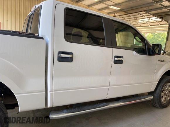 2014 Ford F-150 XL with VIN 1FTFW1EF9EKF91498, listed as a IAAI auction lot 42143154 with 139,151 mi miles. Bid and sale history available at carsss.com. Image 1.