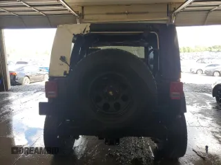 2009 Jeep Wrangler Sahara with VIN 1J4FA54159L772622, listed as a Copart auction lot 55648305 with 141,880 mi miles and Salvage title. Bid and sale history available at DreamBid. Image 6.