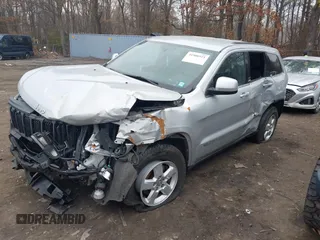 2013 Jeep Grand Cherokee Laredo with VIN 1C4RJFAGXDC537367, listed as a IAAI auction lot 41906921 with 124,679 mi miles. Bid and sale history available at carsss.com. Image 2.