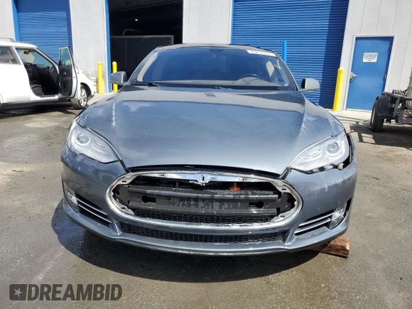 2013 Tesla Model S with VIN 5YJSA1CG9DFP09733, listed as a Copart auction lot 71574474 with 88,163 mi miles and Salvage title. Bid and sale history available at DreamBid. Image 5.