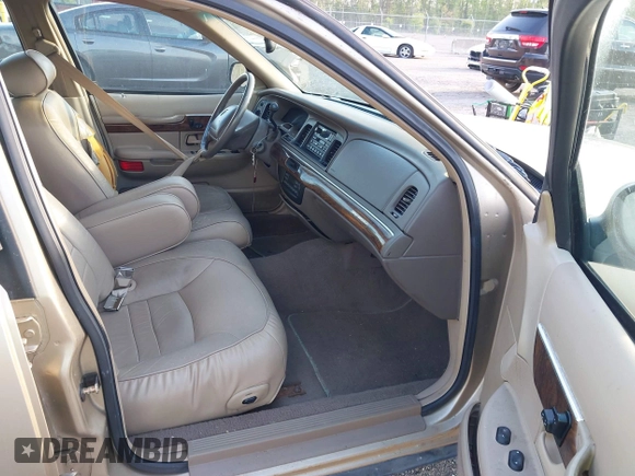 1999 Mercury Grand Marquis LS z VIN 2MEFM75W1XX703878, wystawiony jako IAAI lot #42074187 z przebiegiem 56 962 mil mil oraz . Historia ofert i sprzedaży dostępna na DreamBid. Obrazek 5.