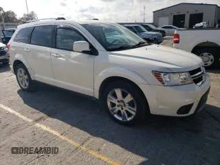 2012 Dodge Journey SXT с VIN 3C4PDCCG7CT211927, выставлен на аукционе Copart как лот 77769624 с пробегом 136 819 миль миль и Списание • Salvage title. История ставок и продаж доступна на DreamBid. Изображение 4.