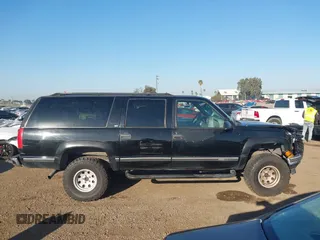 1999 GMC Suburban with VIN 3GKEC16R7XG527908, listed as a IAAI auction lot 41657788 with 216,894 mi miles. Bid and sale history available at carsss.com. Image 13.
