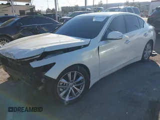 2014 Infiniti Q50 with VIN JN1BV7AP5EM678664, listed as a IAAI auction lot 41641222 with 86,385 mi miles and . Bid and sale history available at carsss.com. Image 2.