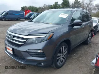 2017 Honda Pilot Touring with VIN 5FNYF6H92HB012090, listed as a IAAI auction lot 41882542 with 110,179 mi miles and . Bid and sale history available at DreamBid. Image 17.