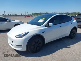 2024 Tesla Model Y with VIN 7SAYGDED9RF161420, listed as a IAAI auction lot 41892788 with 12,353 mi miles and . Bid and sale history available at DreamBid. Image 17.