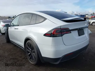 2023 Tesla Model X with VIN 7SAXCBE54PF384403, listed as a IAAI auction lot 40947187 with 16,881 mi miles and . Bid and sale history available at DreamBid. Image 3.