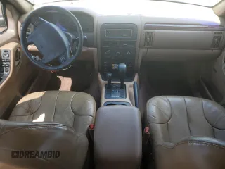 2000 Jeep Grand Cherokee Laredo z VIN 1J4GW48N0YC210235, wystawiony jako Copart lot #60558905 z przebiegiem 131 108 mil mil oraz Szkoda całkowita • Salvage title. Historia ofert i sprzedaży dostępna na DreamBid. Obrazek 8.