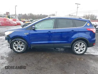 2014 Ford Escape Titanium with VIN 1FMCU9J99EUA46103, listed as a IAAI auction lot 42018097 with 169,878 mi miles and . Bid and sale history available at DreamBid. Image 14.