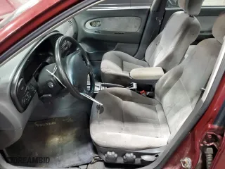 2003 Kia Spectra with VIN KNAFB121735217341, listed as a Copart auction lot 72016504 with 116,224 mi miles and Salvage Title. Bid and sale history available at carsss.com. Image 7.