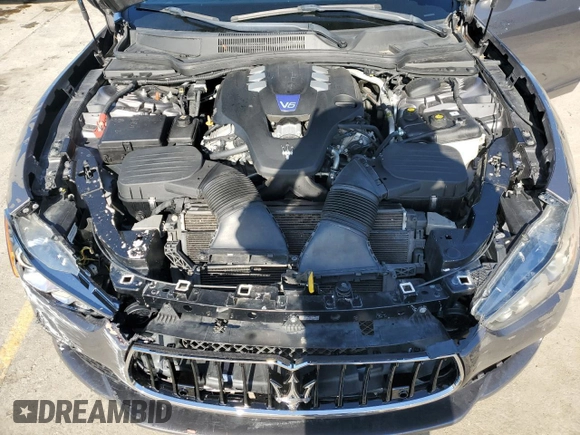 2016 Maserati Ghibli S Q4 z VIN ZAM57RTA8G1173582, wystawiony jako Copart lot #48792615 z przebiegiem Nie podano mil oraz Szkoda całkowita • Salvage title. Historia ofert i sprzedaży dostępna na DreamBid. Obrazek 11.