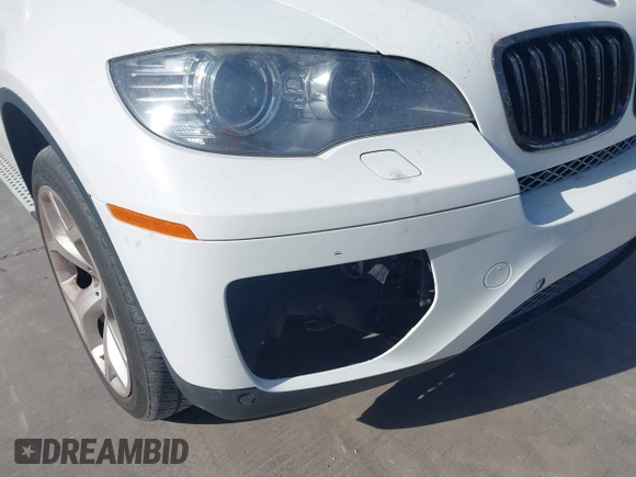 2014 BMW X6 xDrive35i z VIN 5UXFG2C5XE0C44062, wystawiony jako IAAI lot #41848304 z przebiegiem 154 683 mil mil oraz . Historia ofert i sprzedaży dostępna na DreamBid. Obrazek 6.