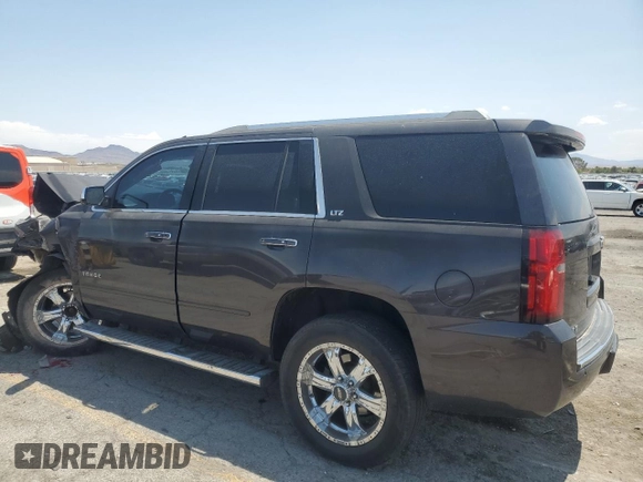 2015 Chevrolet Tahoe LTZ with VIN 1GNSKCKC2FR157035, listed as a Copart auction lot 59990415 with Not provided miles and Salvage title. Bid and sale history available at DreamBid. Image 2.