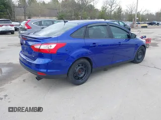 2014 Ford Focus SE with VIN 1FADP3F21EL314534, listed as a IAAI auction lot 42130032 with 103,866 mi miles. Bid and sale history available at carsss.com. Image 4.