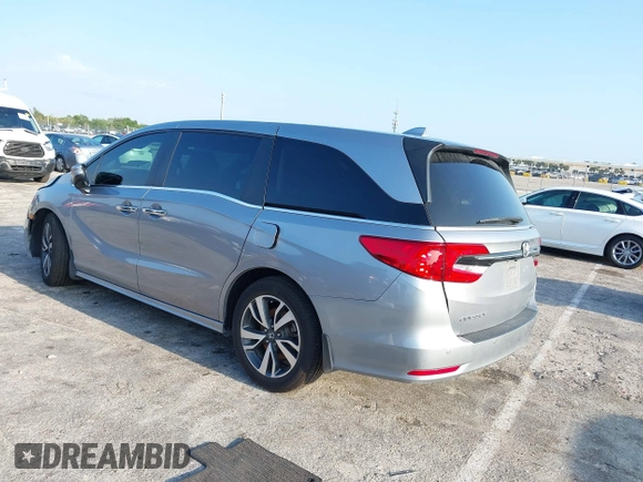 2023 Honda Odyssey Touring with VIN 5FNRL6H86PB020700, listed as a IAAI auction lot 41961098 with 66,512 mi miles and . Bid and sale history available at DreamBid. Image 3.