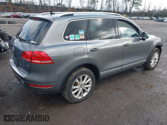 2013 Volkswagen Touareg Lux with VIN WVGEF9BPXDD000679, listed as a IAAI auction lot 41956471 with 117,465 mi miles and . Bid and sale history available at DreamBid. Image 4.