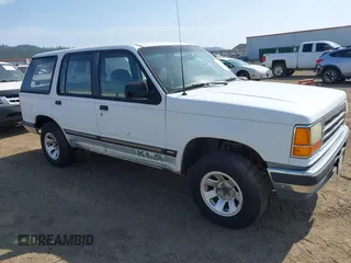 1992 Ford Explorer Eddie Bauer z VIN 1FMDU34X7NUA59055, wystawiony jako IAAI lot #42472171 z przebiegiem 98 269 mil mil oraz . Historia ofert i sprzedaży dostępna na DreamBid. Obrazek 1.