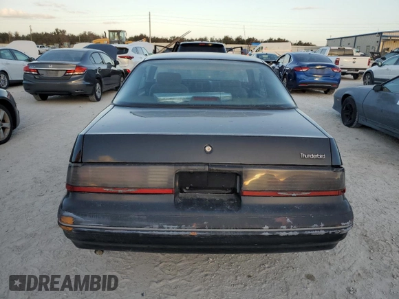 1988 Ford Thunderbird with VIN 1FABP60F9JH246775, listed as a Copart auction lot 77428264 with Not Provided miles and Salvage Title. Bid and sale history available at DreamBid. Image 6.