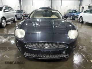 2007 Jaguar XK with VIN SAJWA43C479B18700, listed as a Copart auction lot 83377684 with 143,746 mi miles and Salvage Title. Bid and sale history available at carsss.com. Image 5.