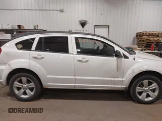 2010 Dodge Caliber SXT with VIN 1B3CB4HA3AD590654, listed as a IAAI auction lot 41814572 with 203,422 mi miles and . Bid and sale history available at DreamBid. Image 14.