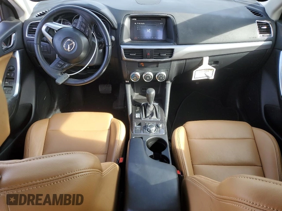 2016 Mazda CX-5 Touring z VIN JM3KE4CY0G0667171, wystawiony jako Copart lot #51579005 z przebiegiem 39 487 mil mil oraz Szkoda całkowita • Salvage title. Historia ofert i sprzedaży dostępna na DreamBid. Obrazek 8.