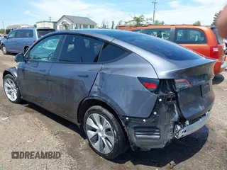 2023 Tesla Model Y Long Range with VIN 7SAYGAEE7PF615751, listed as a IAAI auction lot 42297819 with 31,201 mi miles and . Bid and sale history available at DreamBid. Image 3.