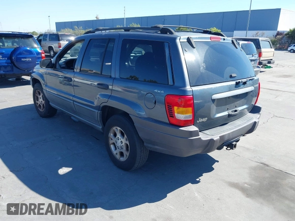 2001 Jeep Grand Cherokee Laredo with VIN 1J4GW48S31C550460, listed as a IAAI auction lot 42769410 with 261,640 mi miles and . Bid and sale history available at DreamBid. Image 3.