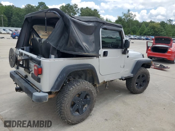 2005 Jeep Wrangler X with VIN 1J4FA39S55P353789, listed as a Copart auction lot 62469015 with 143,817 mi miles and Salvage title. Bid and sale history available at DreamBid. Image 3.