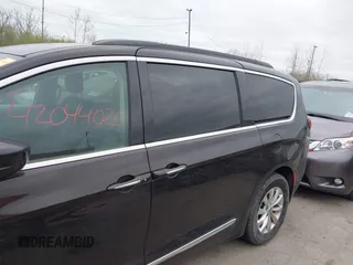 2017 Chrysler Pacifica Touring L with VIN 2C4RC1BG1HR797200, listed as a IAAI auction lot 42044020 with 124,115 mi miles and . Bid and sale history available at DreamBid. Image 14.