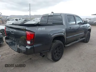 2022 Toyota Tacoma SR with VIN 3TYAX5GN8NT066318, listed as a IAAI auction lot 41739981 with 50,186 mi miles and . Bid and sale history available at DreamBid. Image 4.