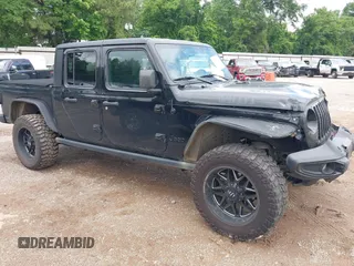2021 Jeep Gladiator Sport S with VIN 1C6JJTAM7ML554412, listed as a IAAI auction lot 42199167 with 74,263 mi miles and . Bid and sale history available at DreamBid. Image 13.