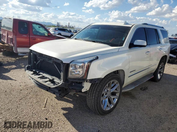 2015 GMC Yukon Denali with VIN 1GKS2CKJ0FR508598, listed as a Copart auction lot 71212924 with 133,220 mi miles and Salvage Title. Bid and sale history available at carsss.com. Image 1.