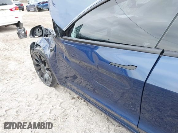 2021 Tesla Model 3 Performance with VIN 5YJ3E1EC6MF996743, listed as a IAAI auction lot 41509631 with 41,599 mi miles and . Bid and sale history available at DreamBid. Image 21.