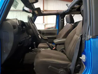 2015 Jeep Wrangler Freedom Edition z VIN 1C4AJWAG7FL520090, wystawiony jako Copart lot #62756975 z przebiegiem Nie podano mil oraz Szkoda całkowita • Salvage title. Historia ofert i sprzedaży dostępna na DreamBid. Obrazek 7.