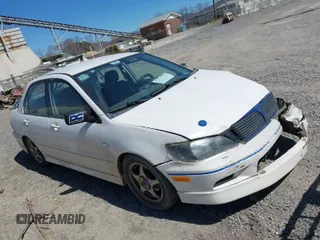 2002 Mitsubishi Lancer OZ-Rally with VIN JA3AJ86E42U039140, listed as a IAAI auction lot 41853888 with 328,181 mi miles. Bid and sale history available at carsss.com. Image 1.