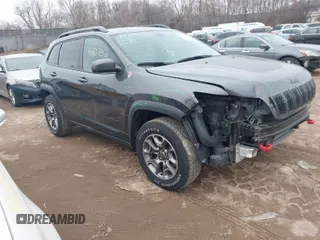 2020 Jeep Cherokee Trailhawk z VIN 1C4PJMBX2LD562699, wystawiony jako IAAI lot #41707512 z przebiegiem 152 729 mil mil oraz . Historia ofert i sprzedaży dostępna na DreamBid. Obrazek 1.